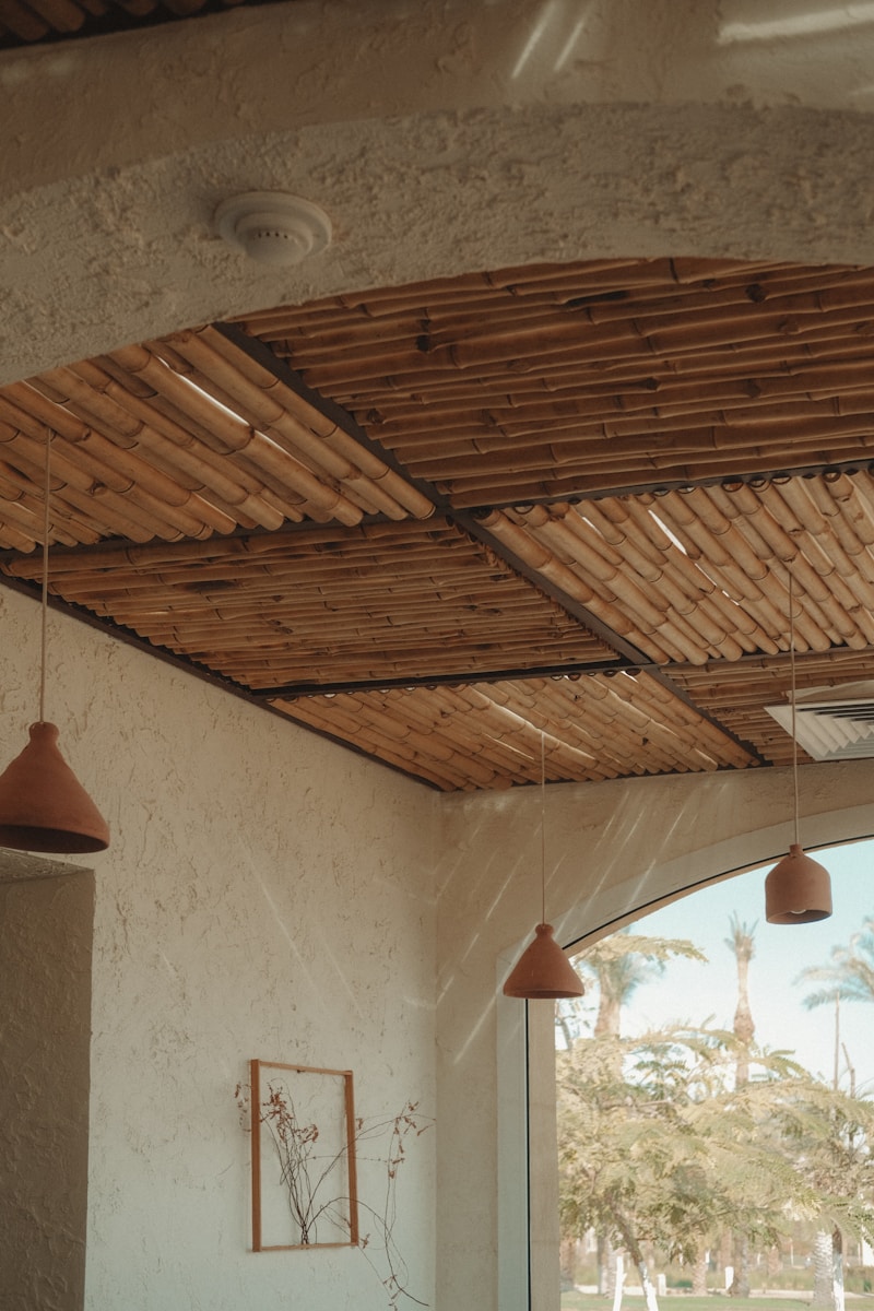 Terracotta pendant lamps against plaster walls