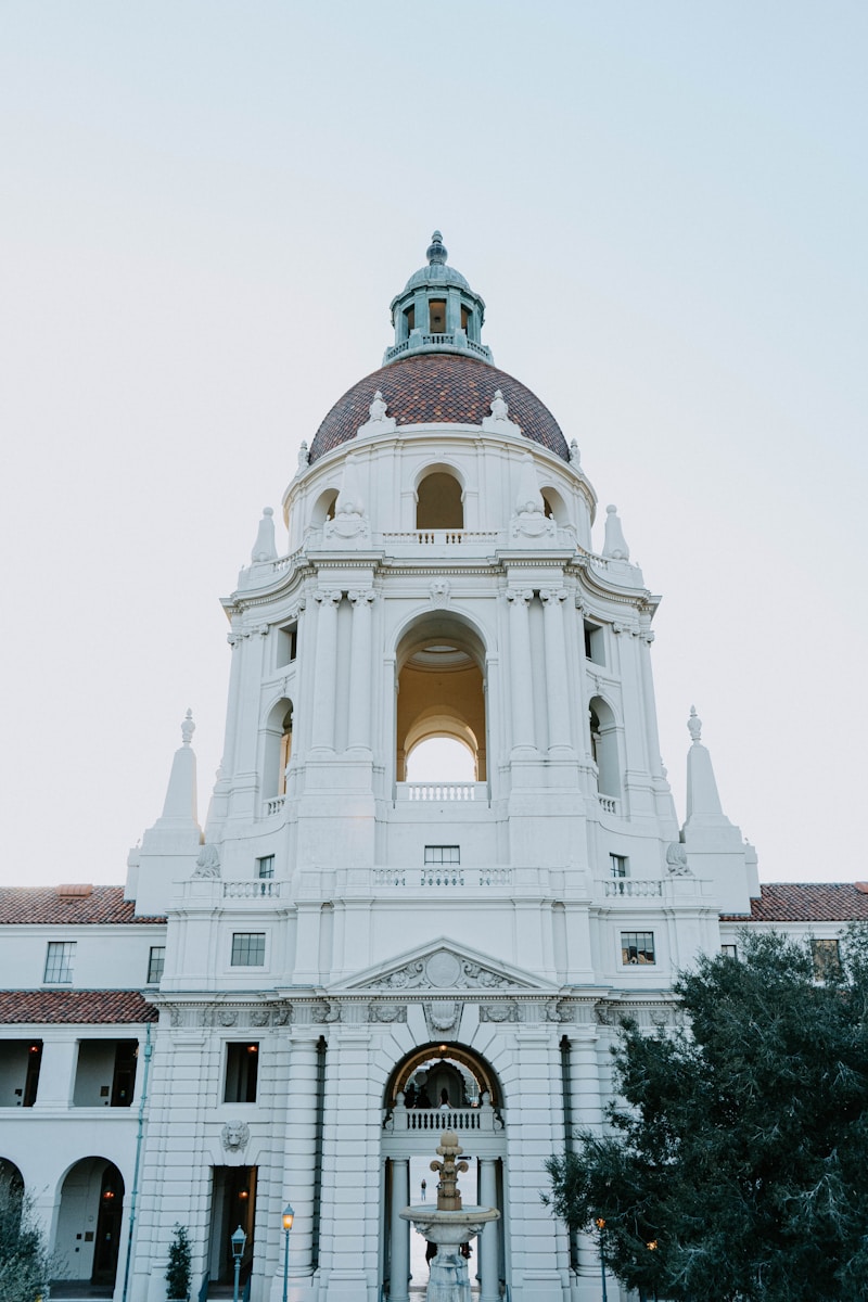 The dome and tower of Pasadena City Hall against a pale evening sky